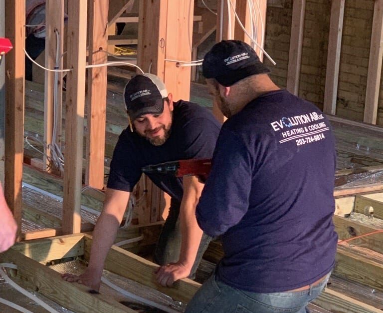 Two men working on a construction site.