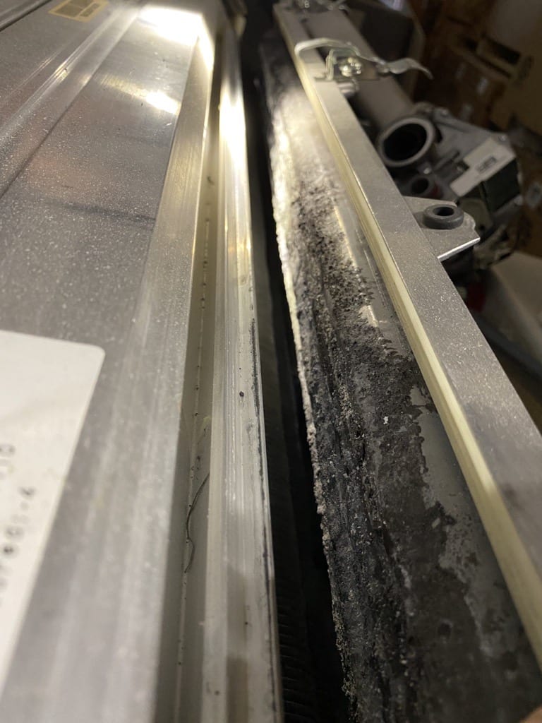 A close up of the bottom of a metal bar